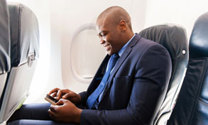 man on plane with mobile device, Xerox, Connect Key, XCL Business Technologies, Xerox, Dell, Islandia, NY, Long Island